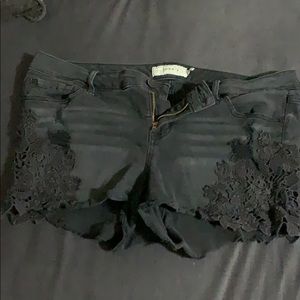 Black lace detailed jean shorts